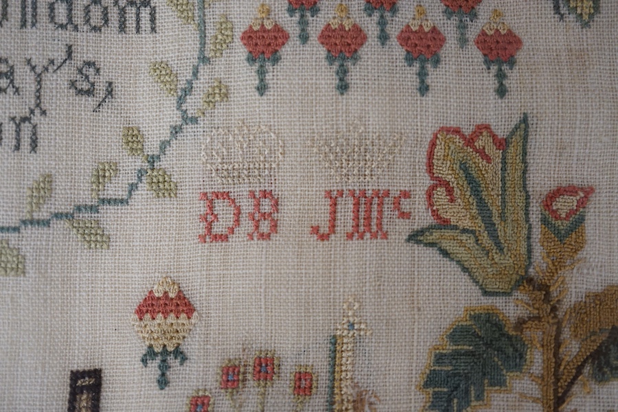 A George lll needlework sampler dated 1806, by Janet Brydon. Worked on fine linen, the sampler embroidered with ornate motifs of angels, birds, deer, lions and a castle around a short embroidered script; I ask not riches